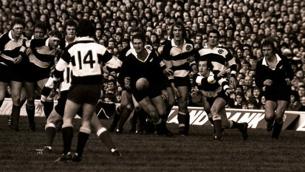 On the run: Gareth Edwards gets the ball away for the Barbarians against the All Blacks at Twickenham in 1973.