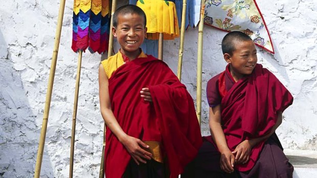 Festival ... young monks with procession flags in Bhutan.
