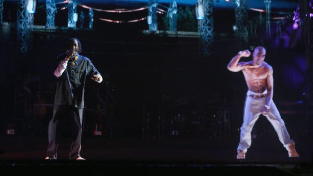 'Digital resurrection' ... rapper Snoop Dogg (left) and a projected image of deceased rapper Tupac Shakur perform onstage during the Coachella Festival.