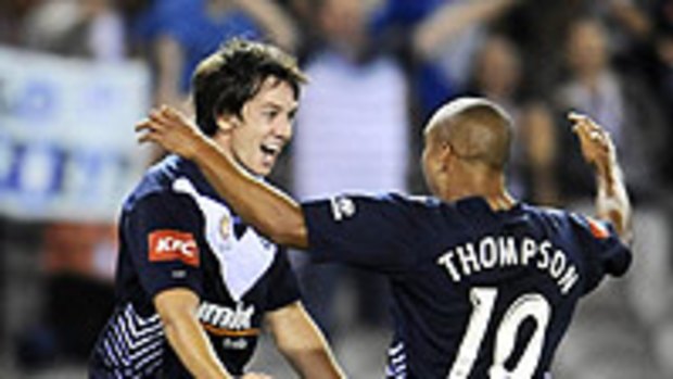 Robbie Kruse celebrates a goal with Archie Thompson during the Victory's match against Perth Glory in January.