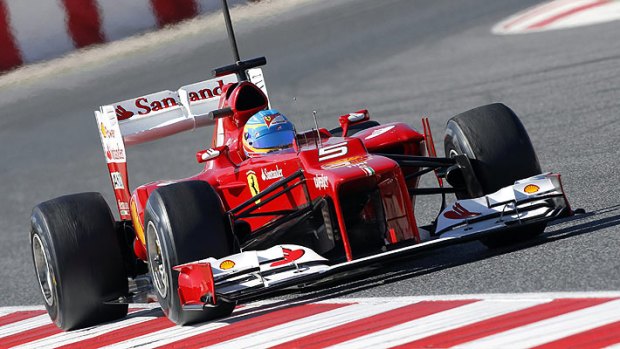 Ferrari's Fernando Alonso drives during a training session near Barcelona.