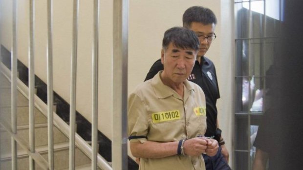 Lee Joon-seok, captain of sunken ferry Sewol, arrives at a court in Gwangju on Monday. Crew members face charges ranging from negligence to homicide.