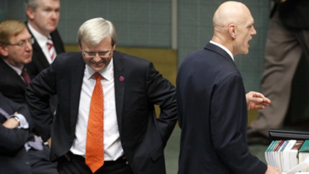 The buck stops here ...  the Prime Minister listens to Peter Garrett during question time yesterday.