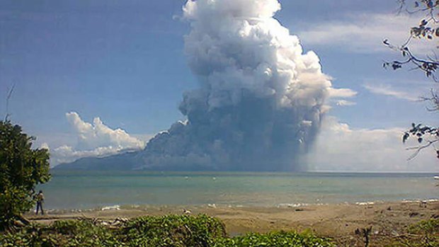 The photo taken from the Maurole district of East Nusa Tenggara province with a camera phone shows Mount Rokatenda volcano spewing a huge column of hot ash during an eruption on August 10, 2013.
