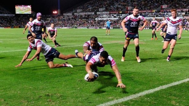 Cowboys winger Matthew Wright touches down against the Roosters.