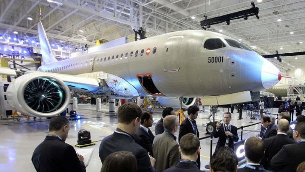 Bombardier's CSeries 100 test plane is unveiled at the company's production facility in Mirabel, Quebec.