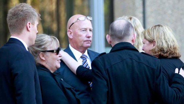 Kelvin and Sharon Crews with family and friends outside court after the sentencing.