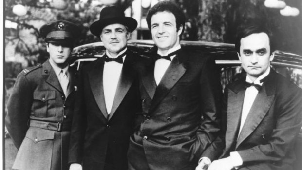 Micheal (Pacino), Don Vito Corleone (Marlon Brando), Sonny (James Caan) and Fredo (John Cazale) in <i>The Godfather</i>.
