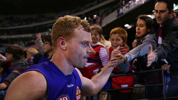 Adam Cooney, who played his 200th game last weekend, has re-signed with Western Bulldogs.