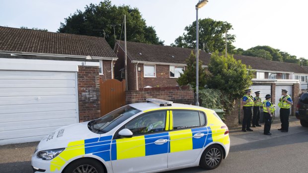 Police outside a property during a search of a house in Pentwyn, Cardiff, believed to be the home of Darren Osborne.