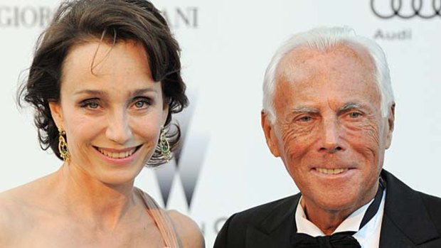 With Italian designer Giorgio Armani at a benefit in France in May.