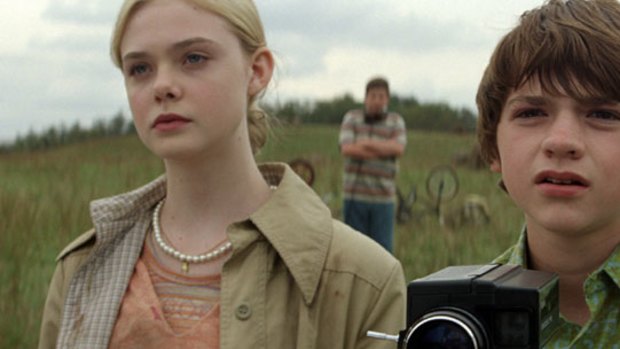 Elle Fanning and Joel Courtney as Alice and Joe in <i>Super 8</i>.
