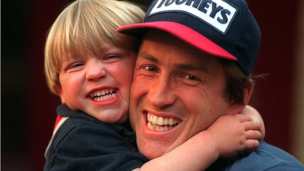 Son and a gun:  Demon great Todd Viney with Jack, aged two.