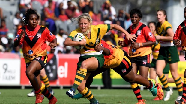 Barnstorming: Lucy Lockhart of the Jillaroos takes on the PNG Orchids.