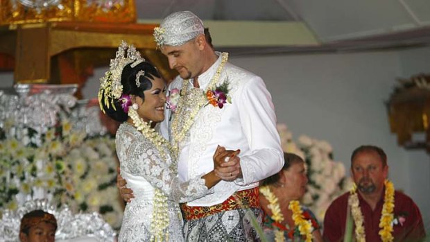 Captive couple: Bali nine heroin courier Martin Stephens and his bride Christine Winarni Puspayanti dance at their wedding inside Kerobokan Prison.