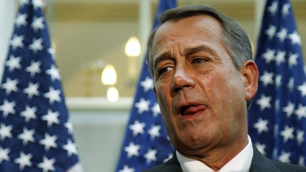 US House Speaker John Boehner pauses between answers to questions during a news conference at the US Capitol in Washington.