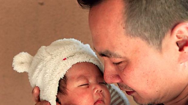 Devastated ... Jason Zheng with two-month-old Alexander.