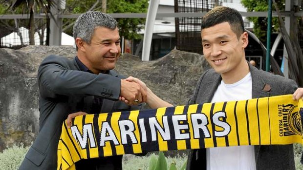 Warm welcome: Central Coast manager Phil Moss welcomes Kim Seung-Yong to Australia on Tuesday.