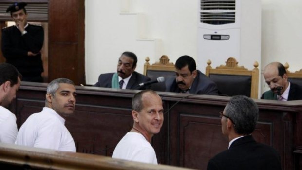 Peter Greste, centre, and fellow Al Jazeera journalists in court on March 31.