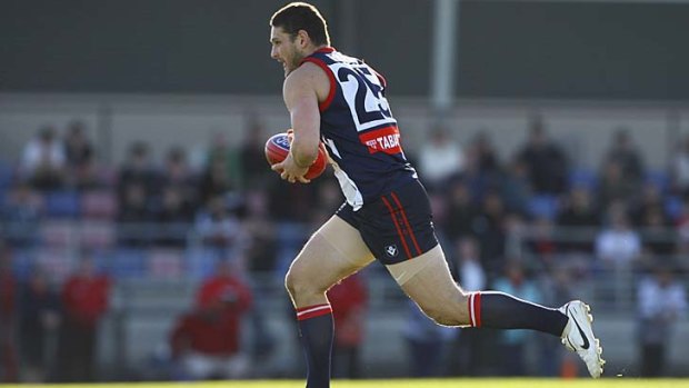 In the running: Brendan Fevola playing for Casey Scorpions.