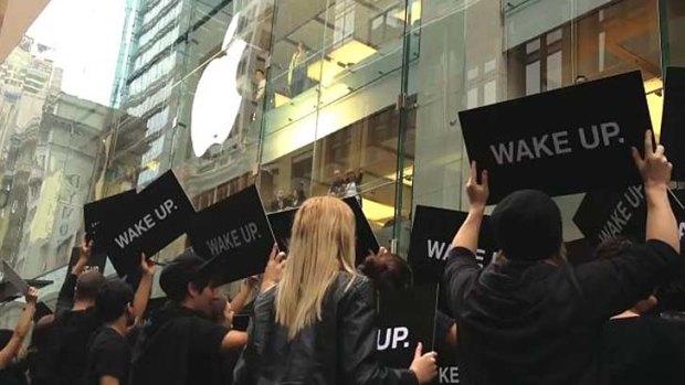 'Wake Up' protestors outside Apple's Sydney CBD store.