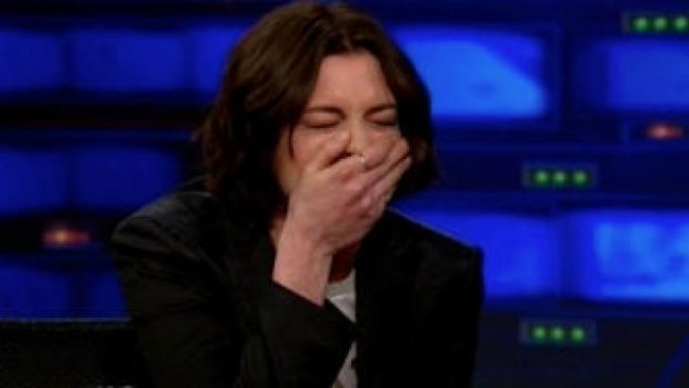 Anne Hathaway trying to keep it together on <i>The Daily Show</i>.