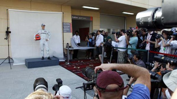 Familiar face . . . Michael Schumacher fronts the media at the Bahrain International Circuit on Thursday. The first formula one race of the season is on there this weekend.
