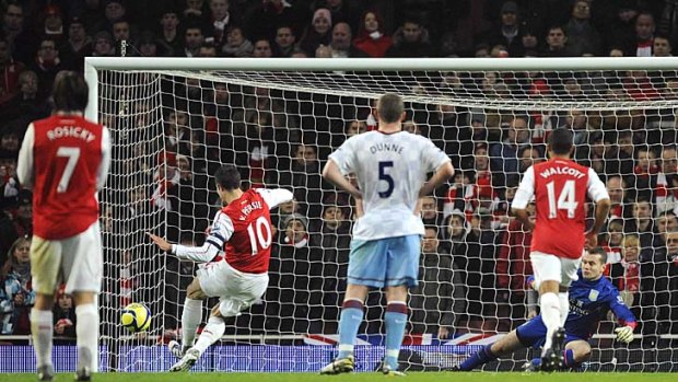 Arsenal's Robin Van Persie scores against Aston Villa during their FA Cup clash.