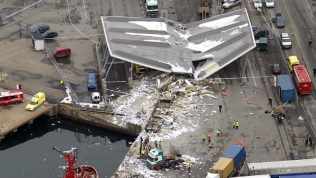 Three dead ... this aerial photo shows the wreckage after a freight train derailed and slammed into a building in an industrial area in Oslo.