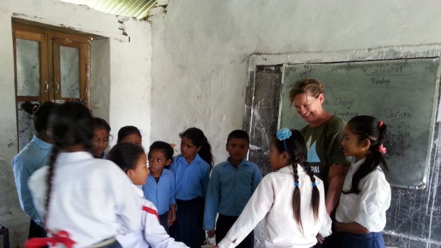 Supporters of Canberra charity REACH for Nepal also spend time with local children, including in the classroom.