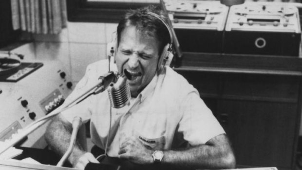 Robin Williams as Adrian Cronauer in a scene from <i>Good Morning Vietnam</i>.