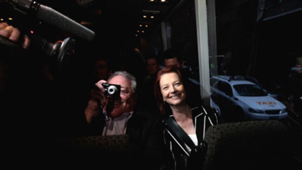 Bus buddies ... News Ltd journalist Malcolm Farr and Julia Gillard on the media coach.