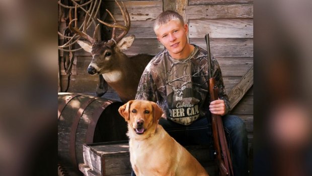 FAMILY TIES: Nebraska senior Kalen Mazenkowski poses with a rifle given to him by his grandfather.