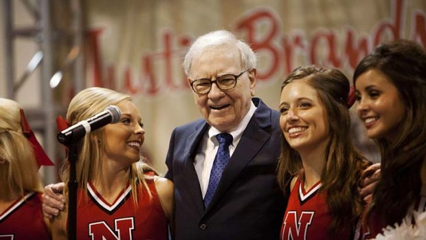 Eye to the future: Billionaire Warren Buffett, 80, and cheerleaders.
