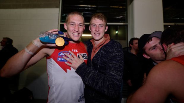 Sam Reid is congratulated by brother Ben on yesterday's win.
