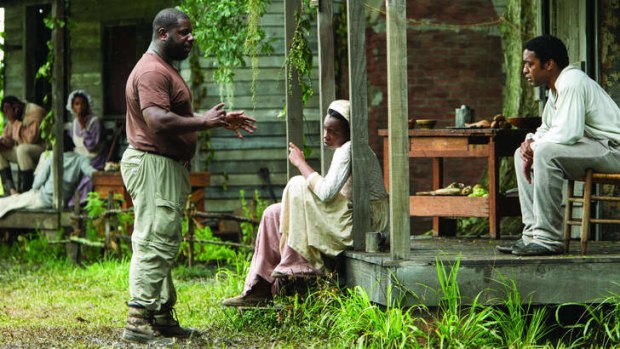 Steve McQueen, left, directing Chiwetel Ejiofor in a scene from <em>12 Years a Slave</em>.