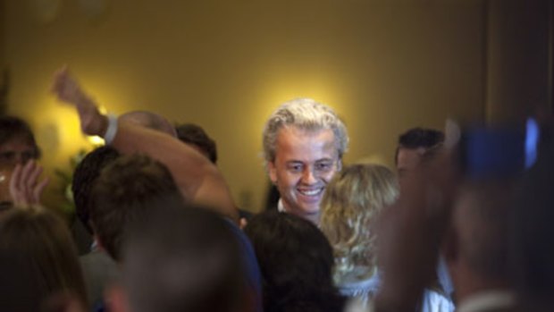Big gains ... the leader of the Party for Freedom, Geert Wilders, greets supporters on election night in The Hague. Mr Wilders is due in court later this year to face charges of inciting racism.