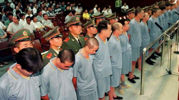 Officials stand trial in Fujian province in China's biggest corruption scandal in November 2000.