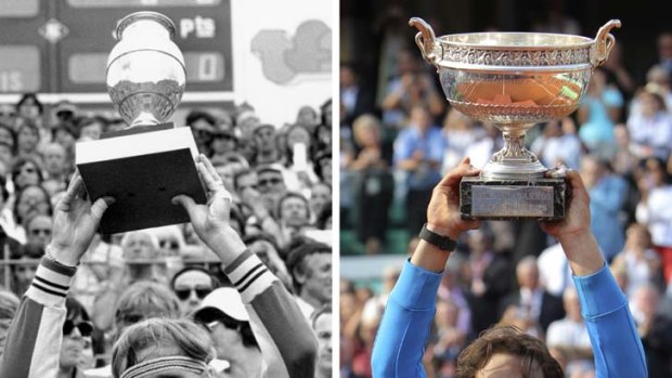 Victorious Nadal, right, lifts the trophy after equalling the record six French Open titles won by legendary Swede, Bjorn Borg, pictured left after his 1980 win.