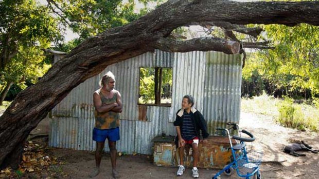 50 year old Earl Conway, left, and 55 year old Algan Thimble, at their iron shack home on Palm Island. <i>Picture: Michael Chambers</i>