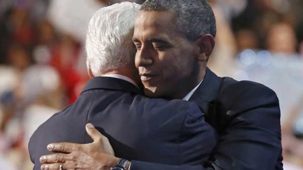 Embracing the  moment ... Bill Clinton and Barack Obama.