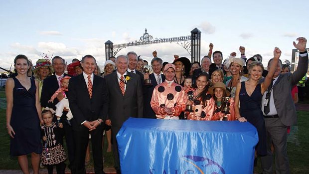 Winners all grinners: Happy connections of Black Caviar celebrate the champion mare's 20th consecutive win.