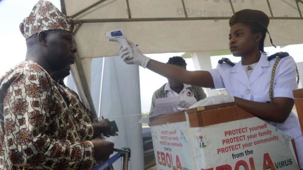 A Nigerian man has his temperature tested at Murtala Mohammed International Airport in Lagos. Millions of Muslims across West Africa are preparing for the annual Haj pilgrimage to Mecca, as fears over the spread of the Ebola virus grow.