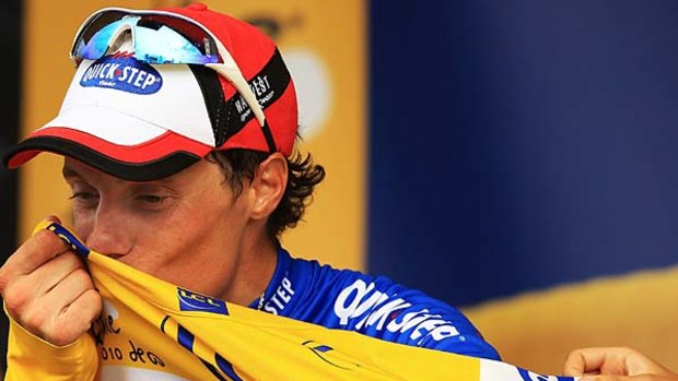 Won his second stage of the Tour ... France's Sylvain Chavanel kisses the yellow jersey.