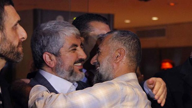 Unchallenged &#8230; the Hamas leader, Khalid Mishal, greets Palestinian prisoners in Cairo on Tuesday.