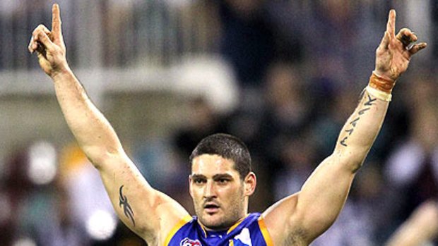 Brendan Fevola wears a power band.