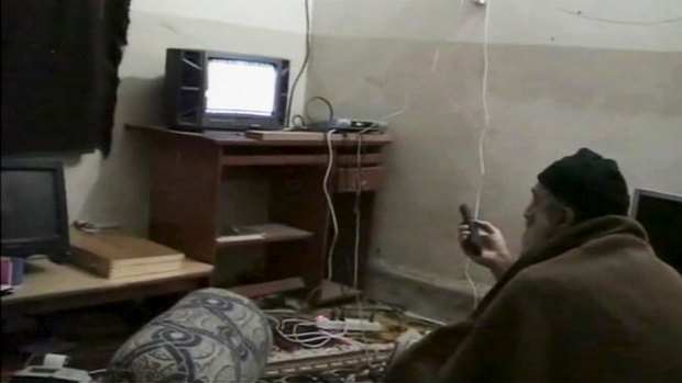 Osama bin Laden watching himself on television in a US Department of Defence video.