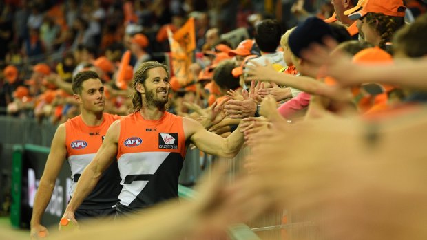 Enjoying the moment: Callan Ward celebrates with fans after the victory in the round six AFL match between the Greater Western Sydney Giants and the Hawthorn Hawks at Spotless Stadium on April 30.