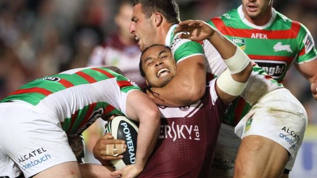 Sam Burgess gets to grips with Steve Matai.