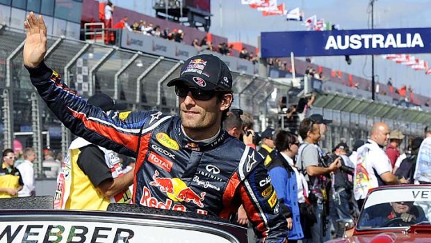 Local hope Mark Webber waves to fans before today's race.